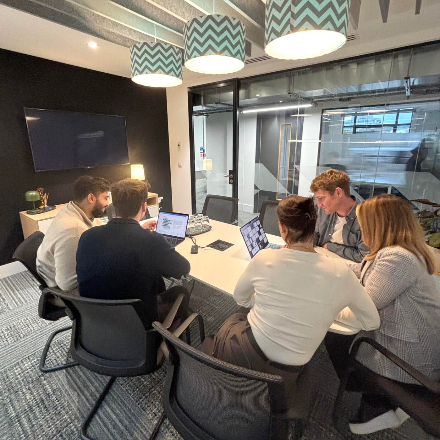 Team collaborating in a modern office